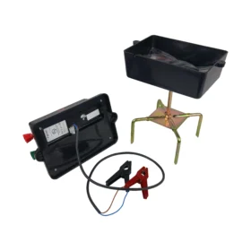 Open view of the Hotline Falcon Fencer 12v battery energiser showing internal battery compartment, connection leads, and sturdy electric fence stand.