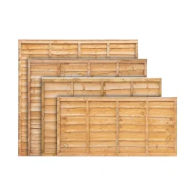 A set of gold dip treated timber lap fence panels of all available heights stacked in front of one another