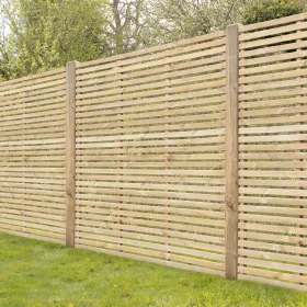 Some single slatted fence panels put up with posts in a garden