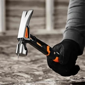An action shot of the Fiskars general use 20oz hammer ready to hammer in a nail