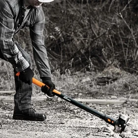 A Fiskars sledge hammer being used to break up the ground