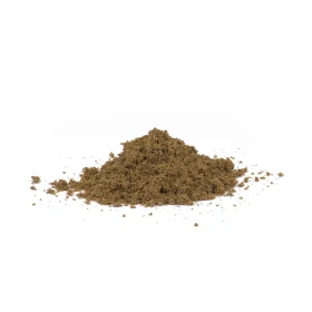 A handful pile of yellow building sand