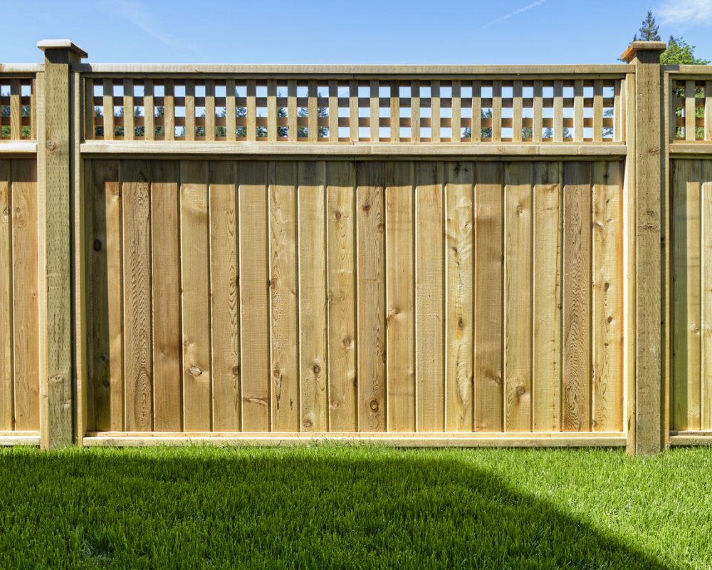 Wood fencing on some grass