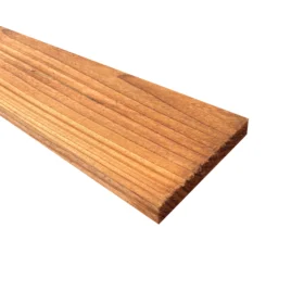 a pressure treated brown gravel board, coming into frame from the top left an angle finishing in the centre