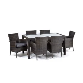 Front-facing view of the Ascot Rattan Rectangular Glass Table and 6 Newbury Chairs Set. The set includes a sleek, tempered glass-top dining table with a durable dark brown rattan frame and six matching armchairs. Each chair features a contemporary woven rattan design with supportive backs, wide arms, and dark grey seat cushions for added comfort. The clean white background highlights the set's elegant, outdoor-ready construction and timeless aesthetic.