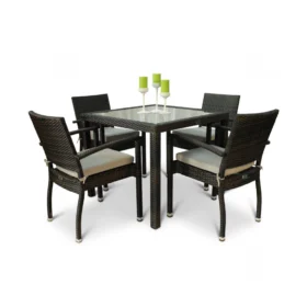 Modern rattan garden furniture set featuring a square glass-top table and four cushioned armchairs, ideal for stylish outdoor dining and patio spaces.