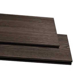 Close-up of two stacked composite decking boards in a dark burnished oak colour with a wood grain textured finish.