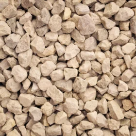 Close-up of Cotswold chippings showing natural buff and cream tones – ideal for decorative landscaping. Available in Cotswold chippings bulk bags and Cotswold stone chippings 20kg bags for garden paths, driveways, and borders.