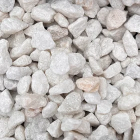 Close up image of polar white chippings 8–11mm, showing angular white and off-white stones with a slightly rough texture.