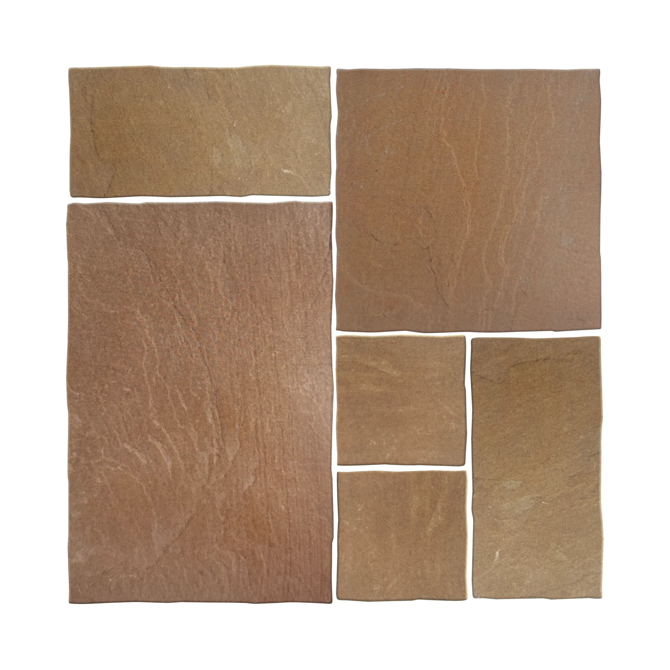 Mixed size buff sandstone slabs in a mock up layout showing natural riven texture.