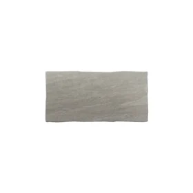 Single Kandla Grey sandstone paving slab measuring 600mm x 290mm, with a lightly riven surface.