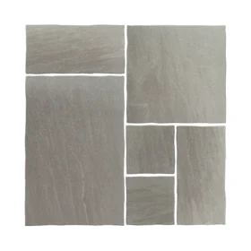 Mixed size Kandla Grey sandstone slabs in a mock up layout showing natural riven texture.