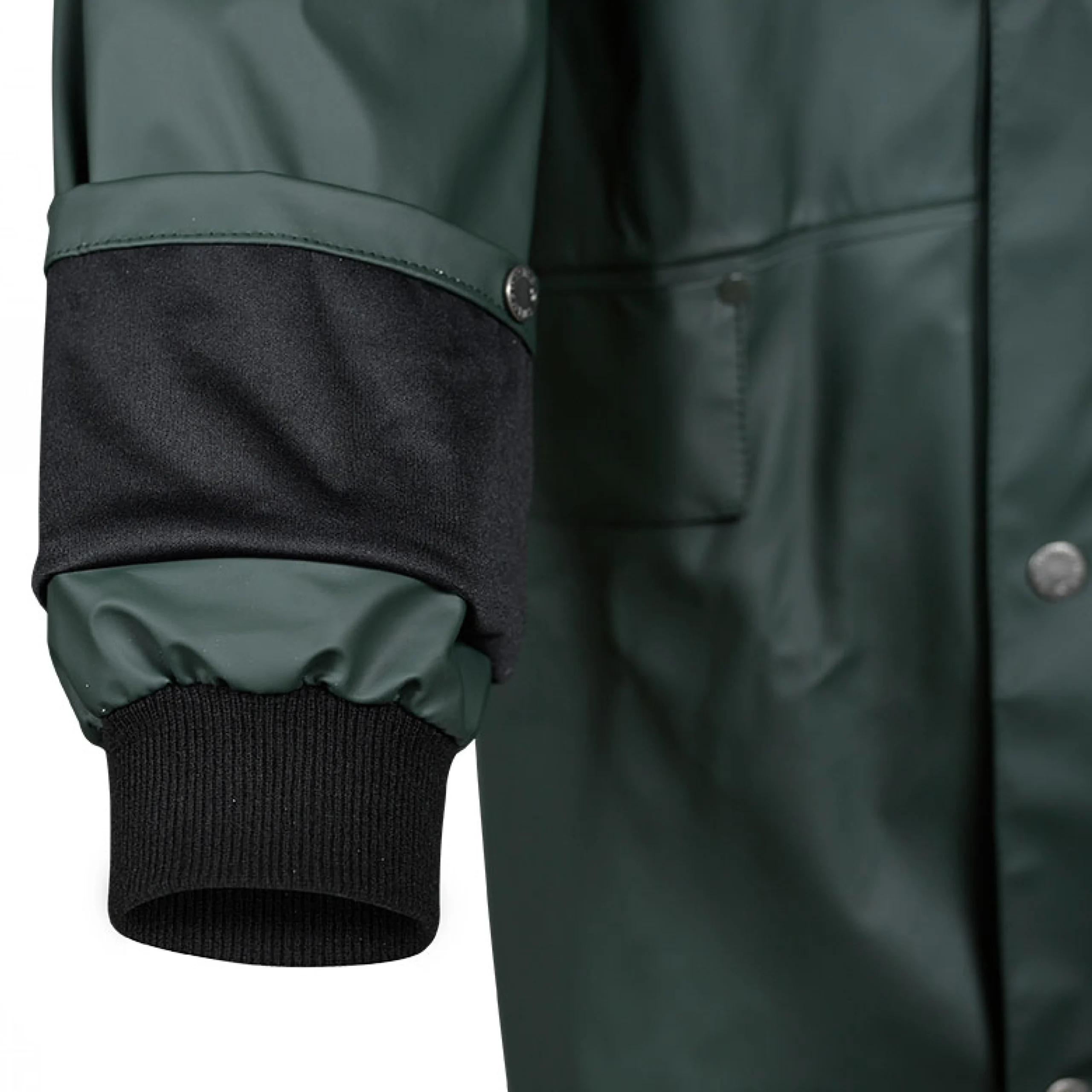 Close-up of sleeve on green waterproof jacket showing adjustable cuff, ribbed inner storm cuff, and snap closure – designed for secure weather protection.