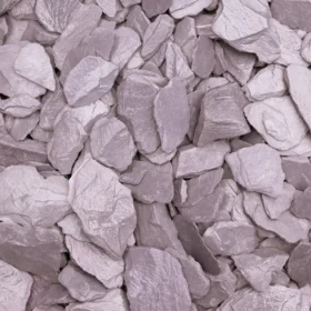 Close-up of decorative plum slate 40mm chippings, ideal for landscaping and garden borders, available in a plum slate bulk bag for large coverage.